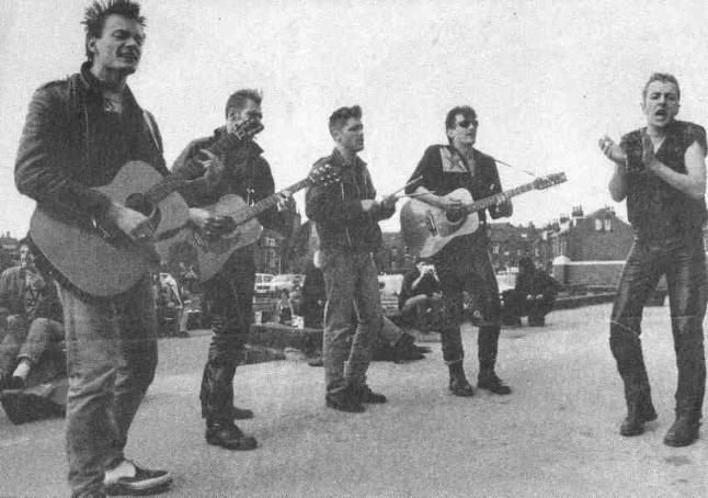 Vince (left) busking in Leeds with the Clash May 1985 (DC Collection)